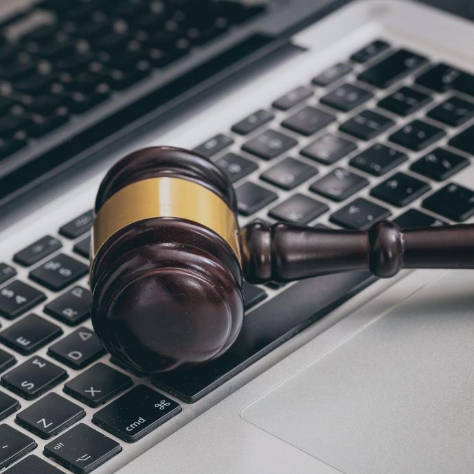 Auction hammer on laptop