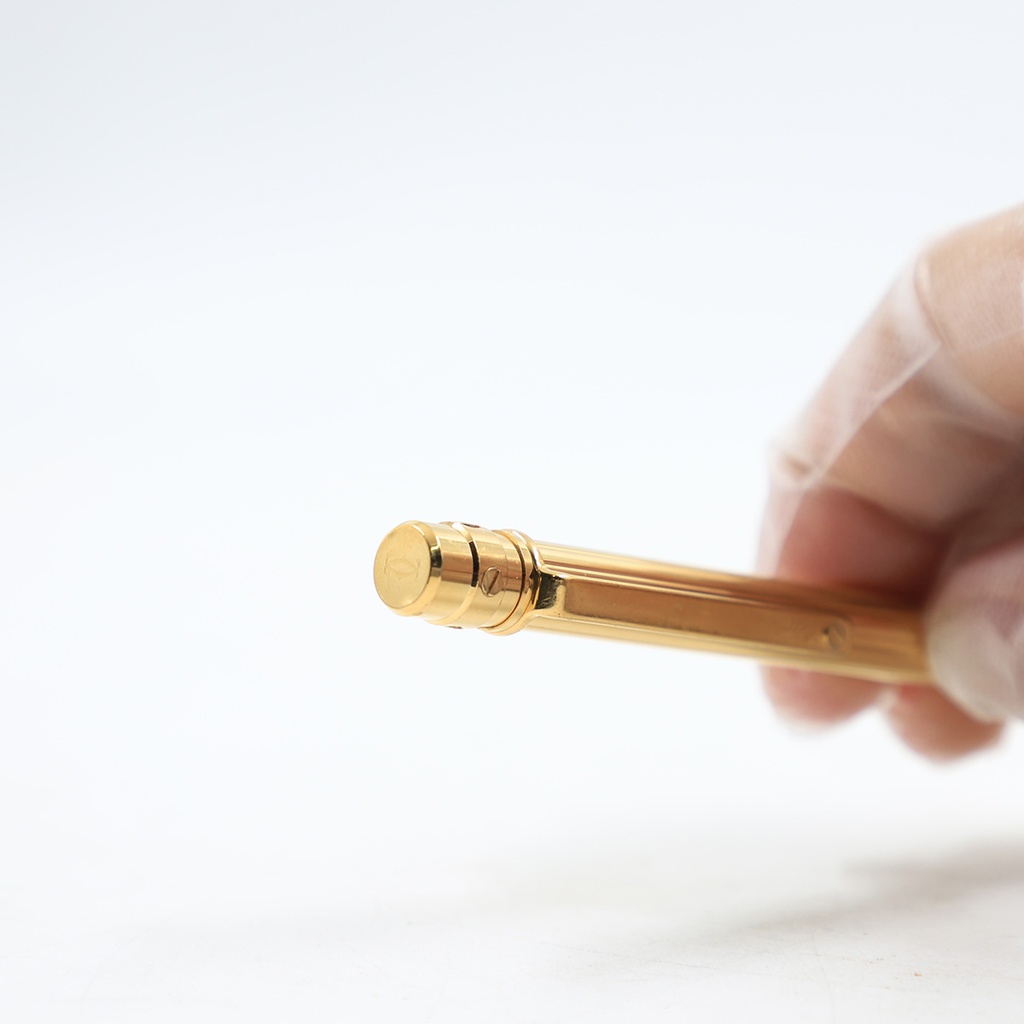 Santos de Cartier ballpoint pen, small model, body in 18K gold (750/1000)-finish metal with gadroon motif 344224