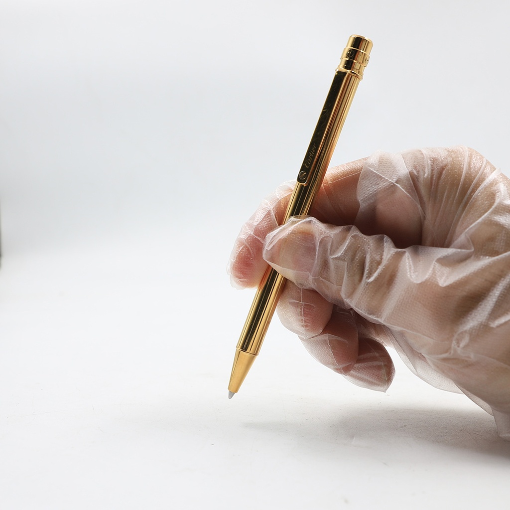 Santos de Cartier ballpoint pen, small model, body in 18K gold (750/1000)-finish metal with gadroon motif 344224