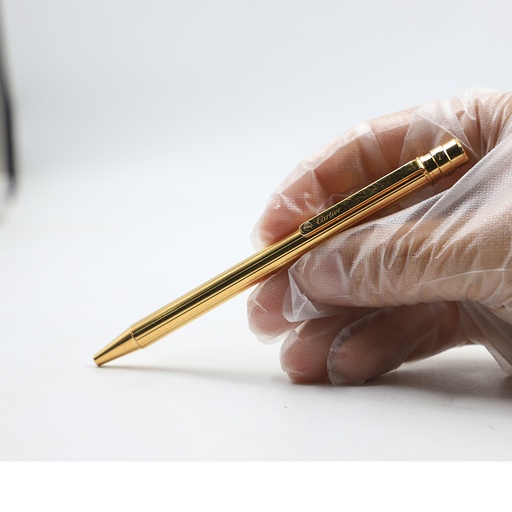 Santos de Cartier ballpoint pen, small model, body in 18K gold (750/1000)-finish metal with gadroon motif 344224