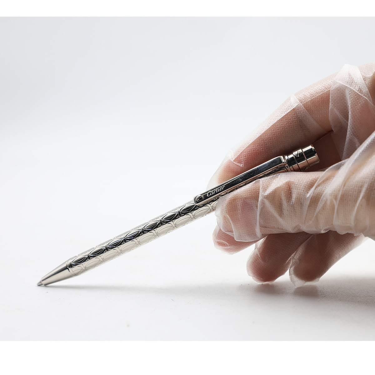 Auction For Santos de Cartier ballpoint pen, small model, palladium-finish C de Cartier motif metal body, palladium-finish screw and details